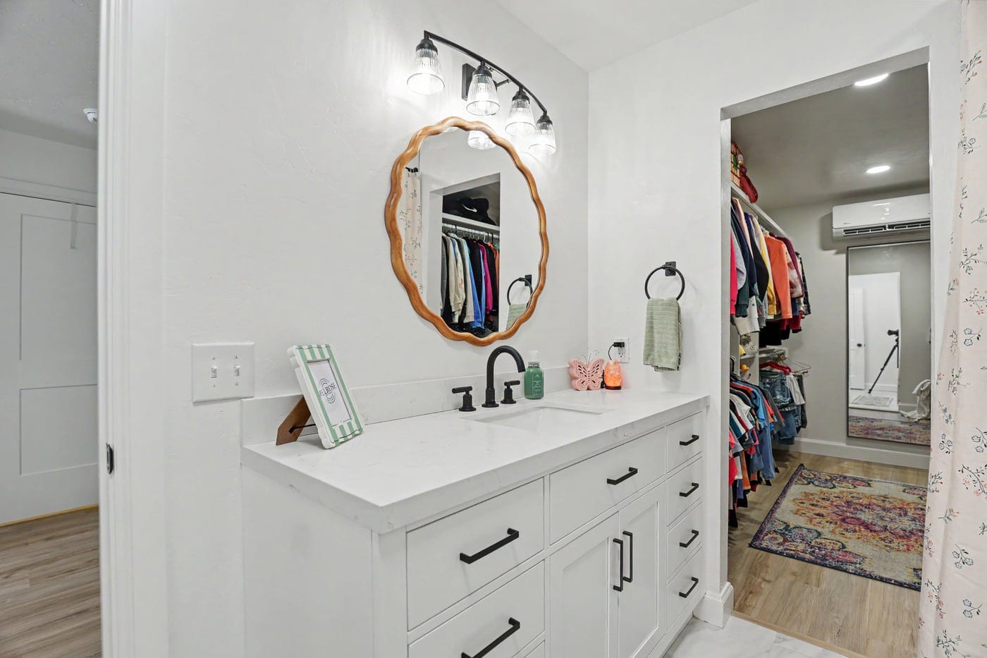 Attic suite bathroom vanity opening into the walk-in closet