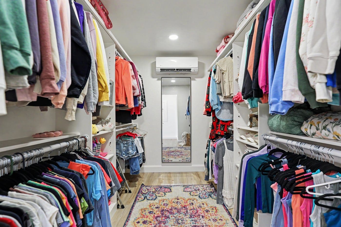 Walk-in closet with built-in shelving in the attic suite
